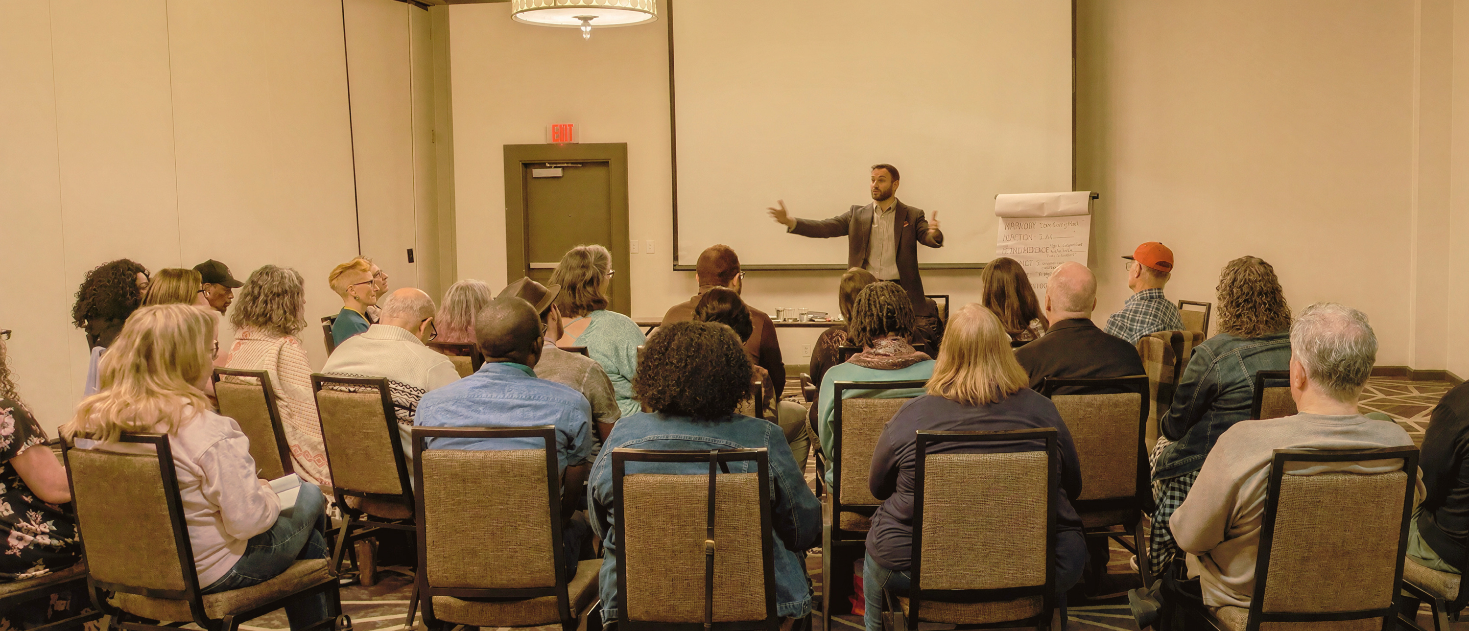 Mischa Byruck leading a workshop in front of a classroom